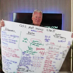 Mark Jennings holding their 90-day plan